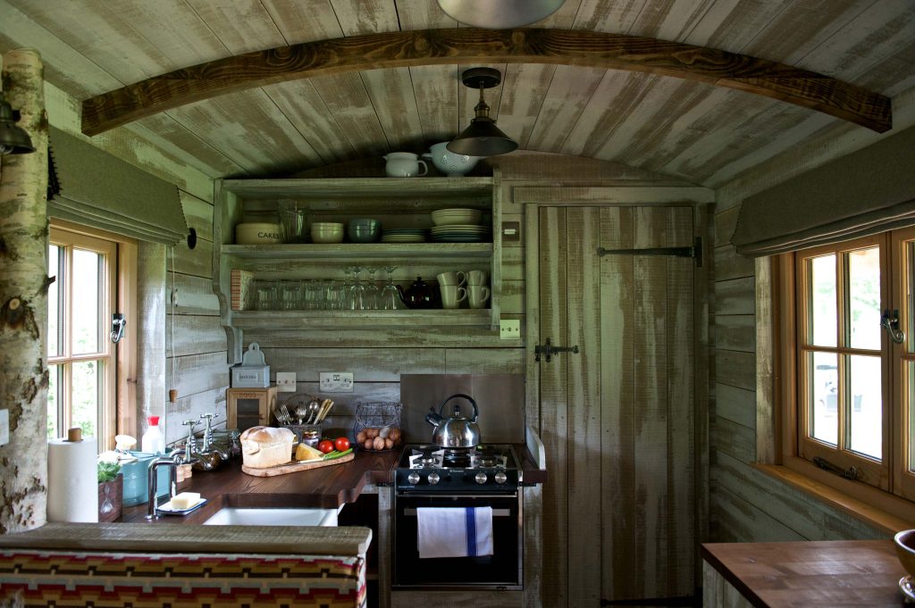The Kitchen area of the Loose Reins cabins with fresh food on the side