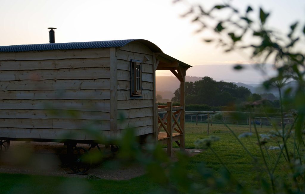 One of Loose Reins' Cabins from behind during sunrise