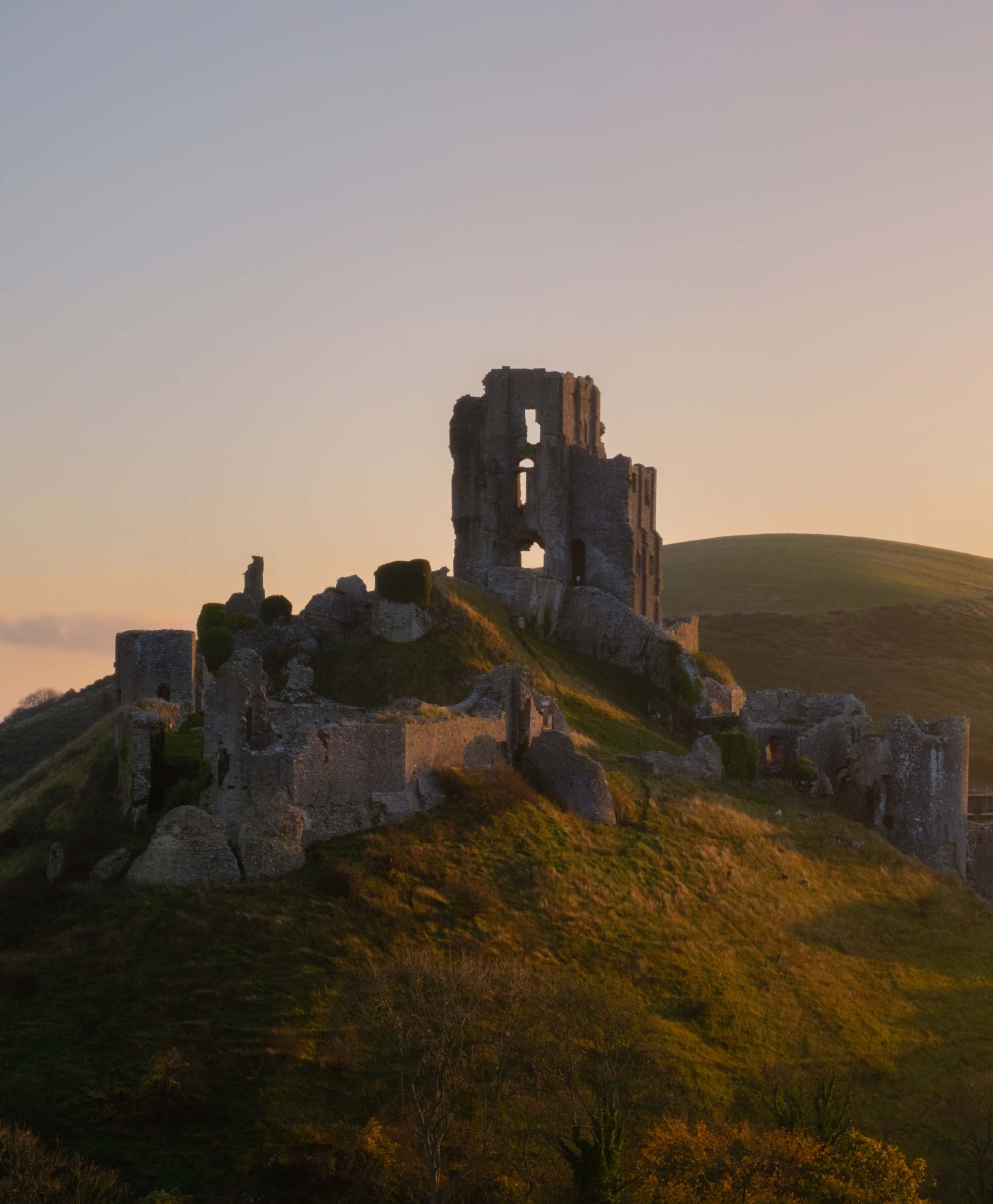 Corfe Castle in Dorset at Sunset