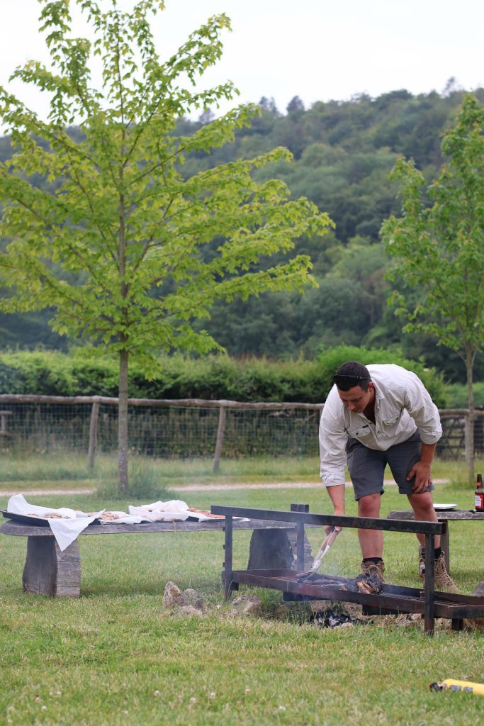 Man cooking on a firepit
