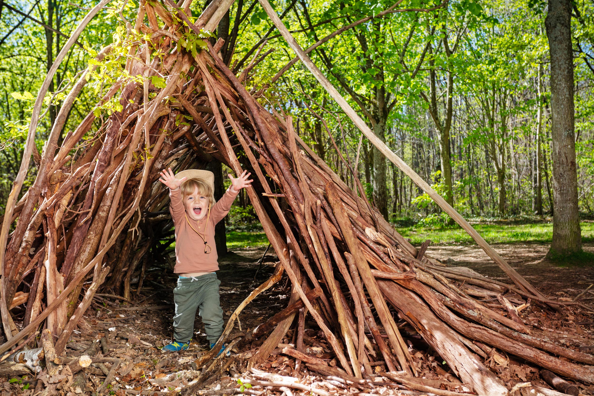 Boy building Den in Dorset Woods
